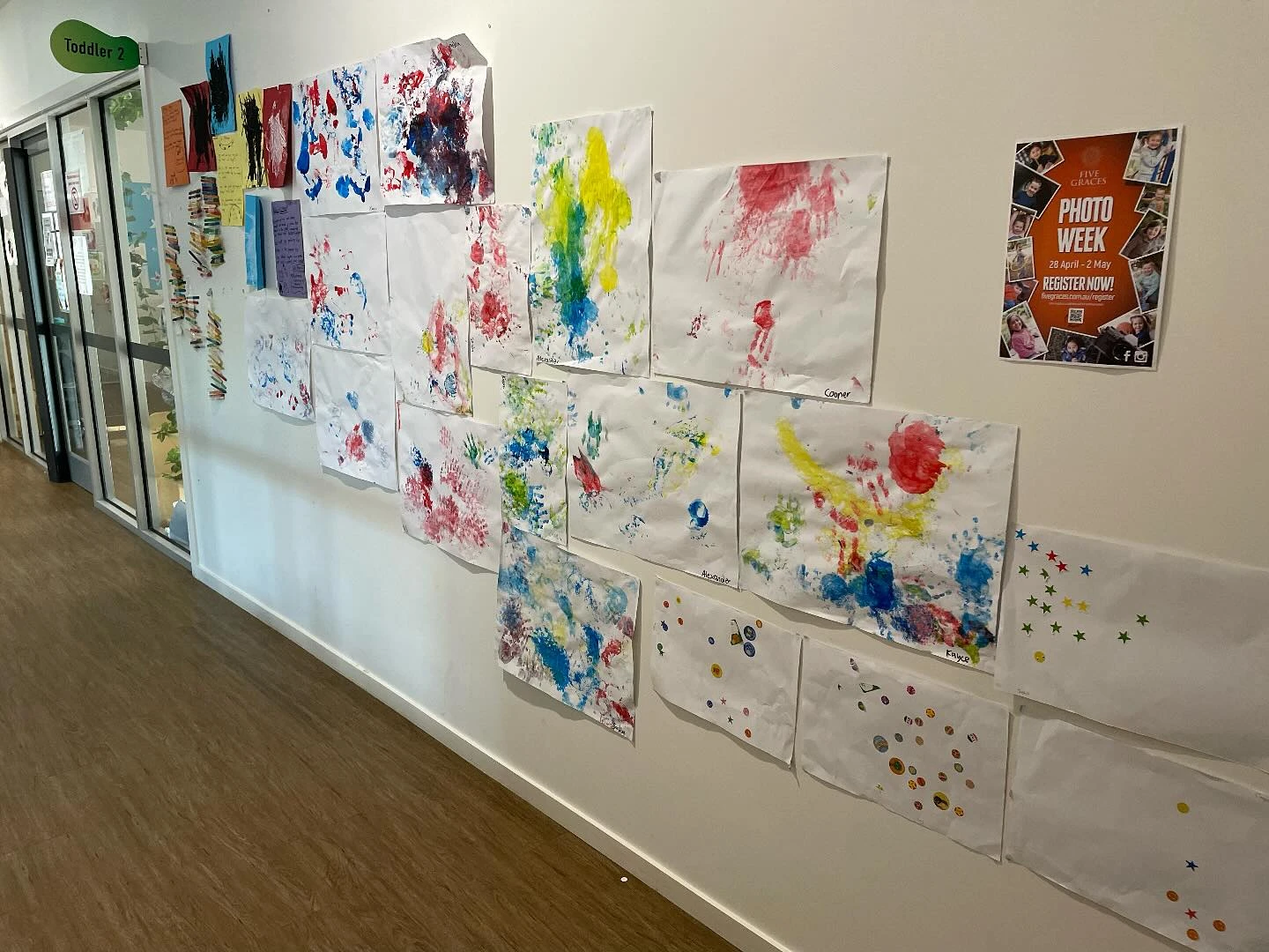 Children's artwork displayed on the classroom wall