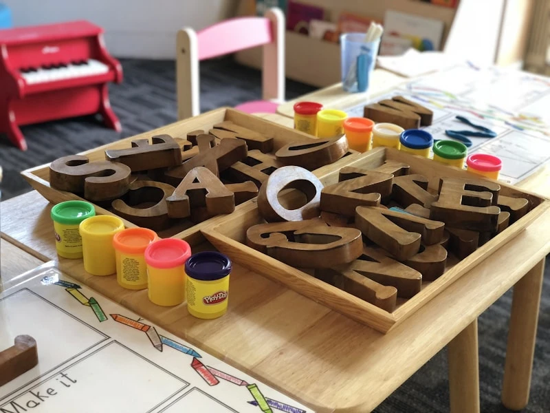 Wooden alphabet letters and playdough literacy activity