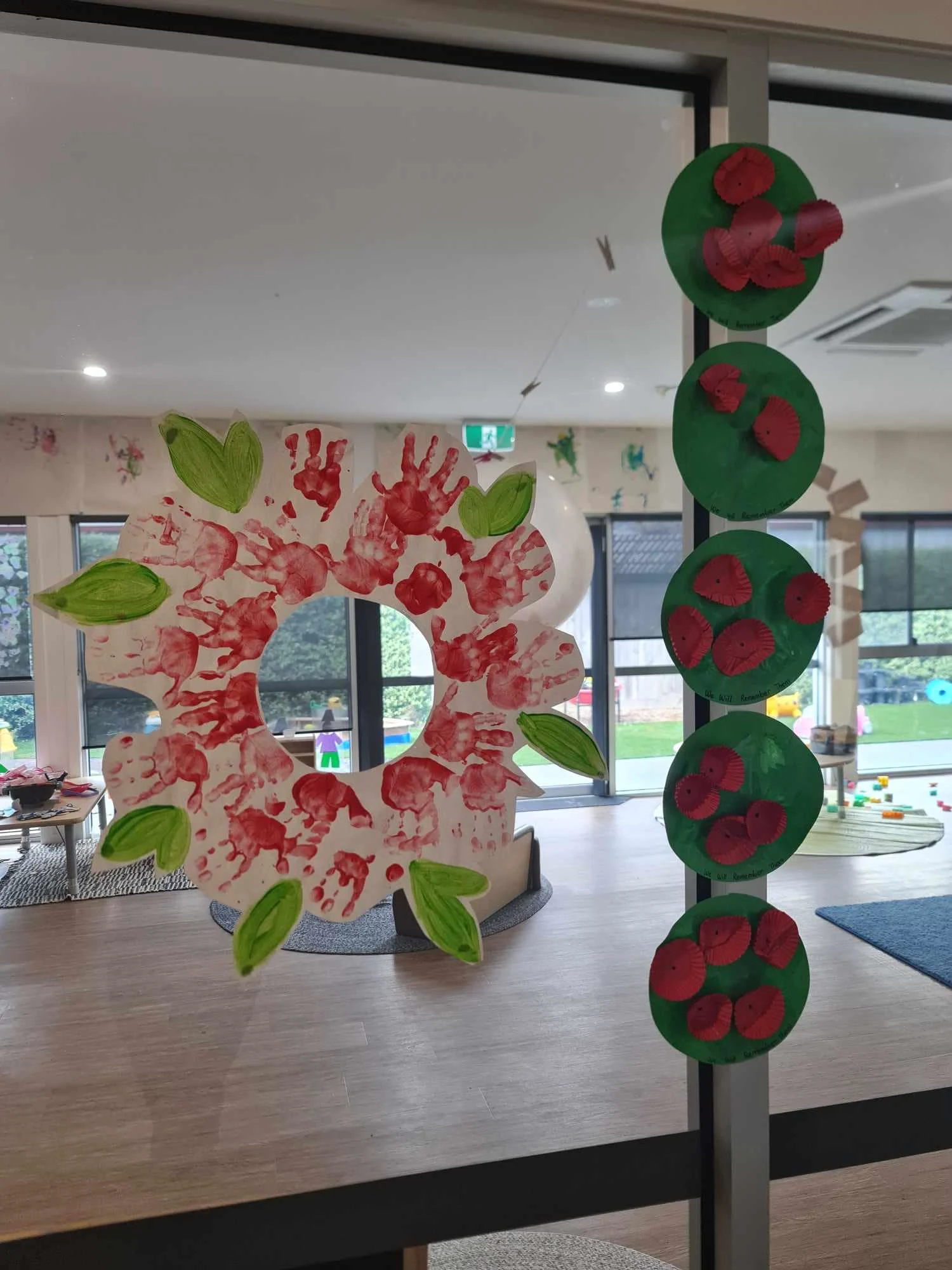 Remembrance poppy handprint wreath made by children